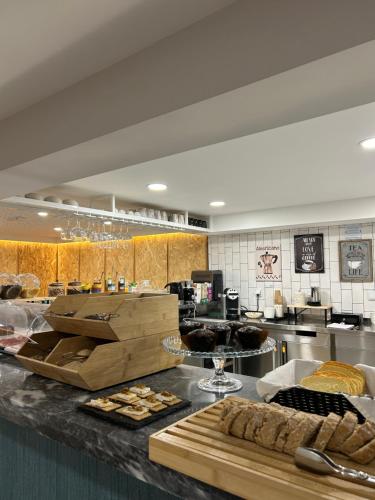 a kitchen with a counter with some food on it at Alma Candida 21 in Valença