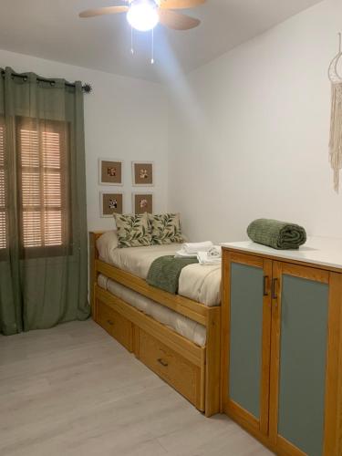 Ένα ή περισσότερα κρεβάτια σε δωμάτιο στο Apartamento Alpe Almagro