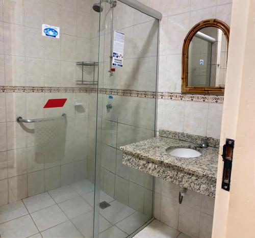 a bathroom with a shower and a sink at Hotel Mirante Da Ilha in Alter do Chao