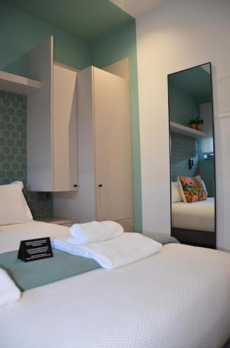 Postel nebo postele na pokoji v ubytování Alma Candida 12