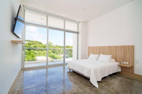 En eller flere senge i et værelse på Beautiful 5BR Villa-Barú Private Pool-Beach club