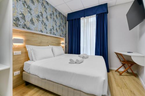 Postel nebo postele na pokoji v ubytování ROME'S GLORIA HOTEL