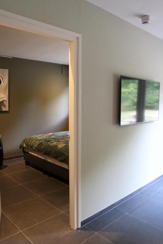 Ένα ή περισσότερα κρεβάτια σε δωμάτιο στο WijkD