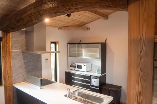 Η κουζίνα ή μικρή κουζίνα στο New Field Chalet 白馬