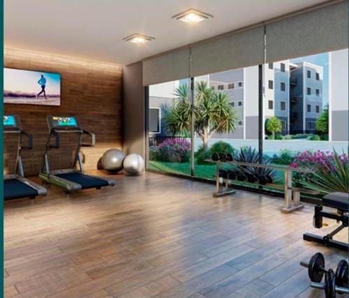 a gym with exercise equipment in a building at Apartamento em Juazeiro do Norte in Juazeiro do Norte