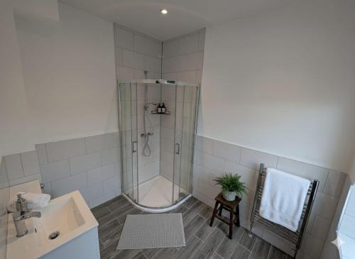 a bathroom with a shower and a sink at Summerhill Sunderland Business Stay 6 Private Ensuite Rooms in Sunderland