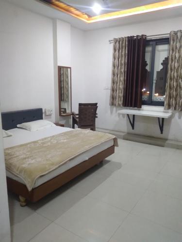 Ένα ή περισσότερα κρεβάτια σε δωμάτιο στο Prakash patel