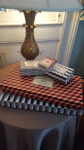 a table with books and a lamp on a table at Barksdale House Inn in Charleston