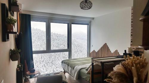 Ένα ή περισσότερα κρεβάτια σε δωμάτιο στο Studio Nordik