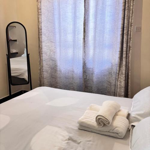 Кровать или кровати в номере EldoTeriki Homes