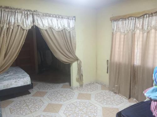 Giường trong phòng chung tại Finca Apolonia