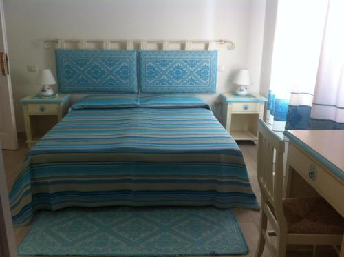 Ένα ή περισσότερα κρεβάτια σε δωμάτιο στο I Graniti