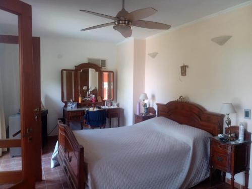 En eller flere senge i et værelse på Casa La Escondida