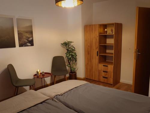 Кровать или кровати в номере Moderne Ferienwohnung am Rennsteig zum Wohlfühlen