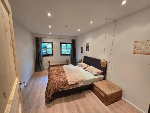 En eller flere senge i et værelse på Haus am Bach