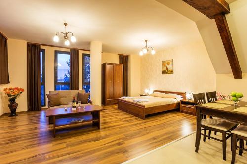 A bed or beds in a room at Apart Hotel Rosen