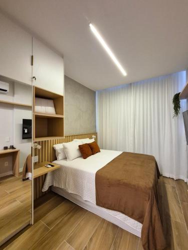 a bedroom with a large bed in a room at Ipanema Charm and Luxury in Rio de Janeiro