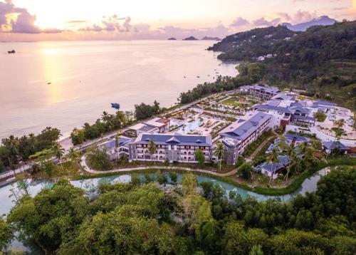 an aerial view of the resort and the water at Canopy By Hilton Seychelles Resort in Anse a La Mouche