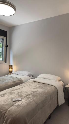 En eller flere senge i et værelse på Departamento entero Lumará