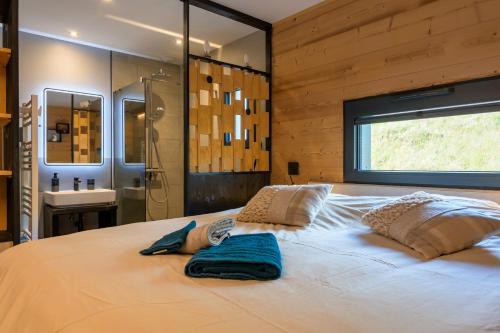 Postel nebo postele na pokoji v ubytování Le chalet Amélie