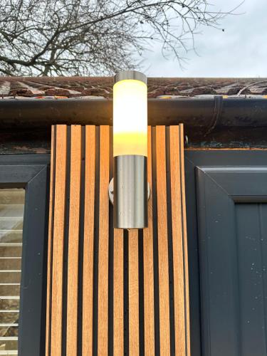 a light on the side of a building at Kettering Railway Lodge in Northamtonshire