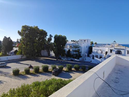 a view of a parking lot from the roof of a building at App corniche hammamet in Hammamet