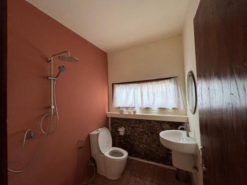 a bathroom with a shower and a toilet and a sink at The Canopy house Private cozy stay Pai Mountains in Pai