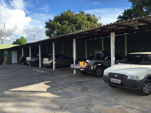 a group of cars parked in a parking lot at Hotel Maracá in Boa Vista