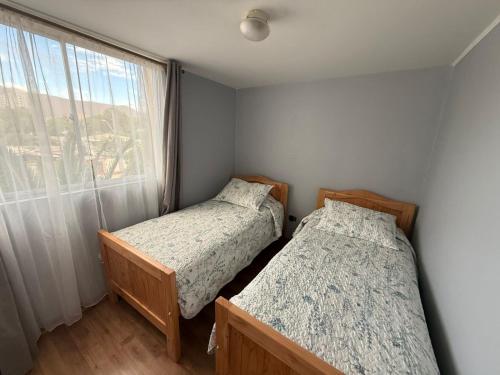 Postel nebo postele na pokoji v ubytování departamento diario Copiapó 3