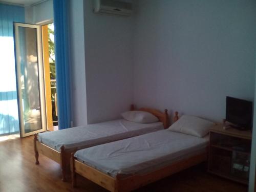 Postel nebo postele na pokoji v ubytování Elias Apartment
