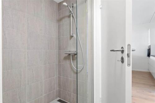 a shower with a glass door in a bathroom at 784-Thisted-Havstokken-30-A in Thisted