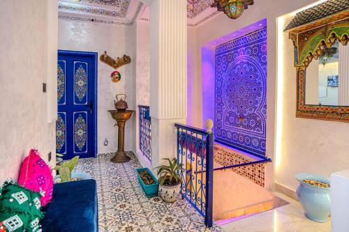 a room with a purple door and a staircase at Laghrib Hostel in Tangier