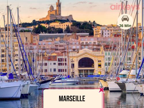 a group of boats docked in a harbor with a city at Le Fit and Chill - Confort & Calme - Parking - Proche Aéroport et Plage du Jaï in Marignane