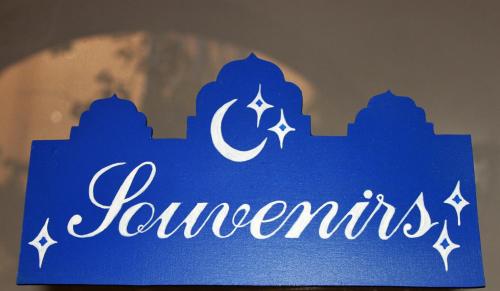a blue sign with the name of a mosque at The Dreamers&Co in Córdoba