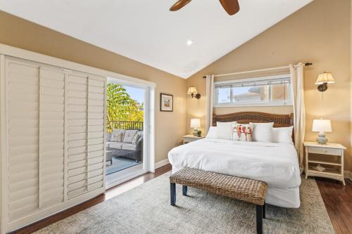 a bedroom with a bed and a large window at 4BR Beach Condo Kids Hideaway Walk to Beach Casino Ole Hanson in San Clemente
