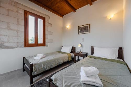 Giường trong phòng chung tại Vamos villa