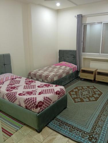 Llit o llits en una habitació de Paradise Rose