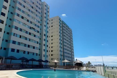 Πισίνα στο ή κοντά στο Lindo Apartamento Vista para o Mar. (2 quartos)