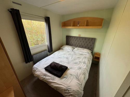 En eller flere senge i et værelse på The Lodge at Woodland Forge