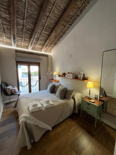 En eller flere senge i et værelse på Casa rural Abuelo Daniel