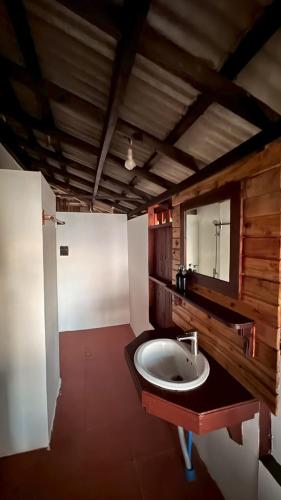 a bathroom with a sink and a mirror at Le Dugong Libong Resort in Ko Libong