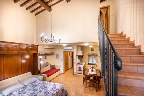 Giường trong phòng chung tại Elsa Holiday Assisi