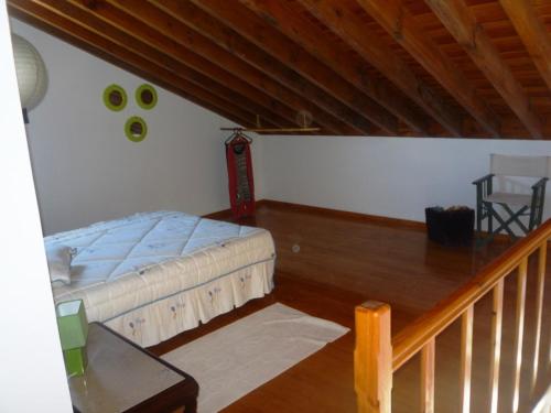 En eller flere senge i et værelse på Casa Miradouro do Pesqueiro