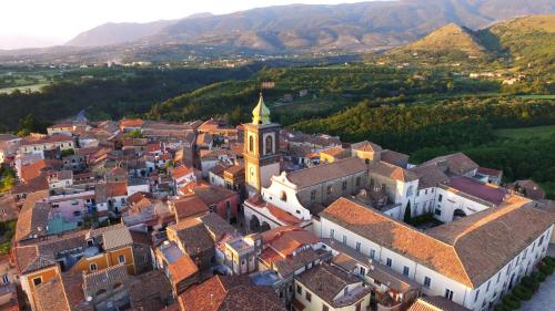 an aerial view of a town with a church at Giualduomo B&B in SantʼAgata deʼ Goti