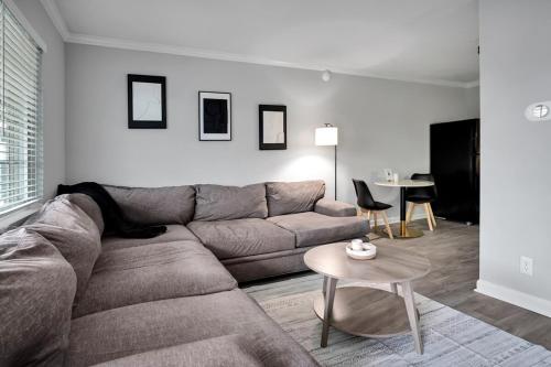 a living room with a couch and a table at Black And White 1 BR by Ryan Korban in Durham