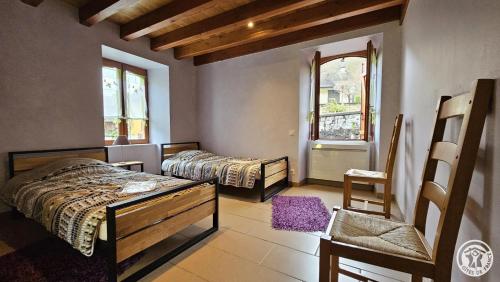 Ένα ή περισσότερα κρεβάτια σε δωμάτιο στο Maison du meunier