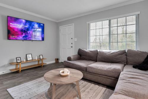 a living room with a couch and a table at Black And White 1 BR by Ryan Korban in Durham