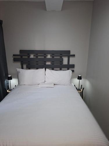 Postel nebo postele na pokoji v ubytování Grace Villas 1