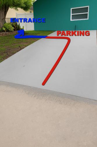 a red line on a white ramp in front of a building at Green Castle Apartment in Tampa 10 min from Airport and the Beach in Tampa