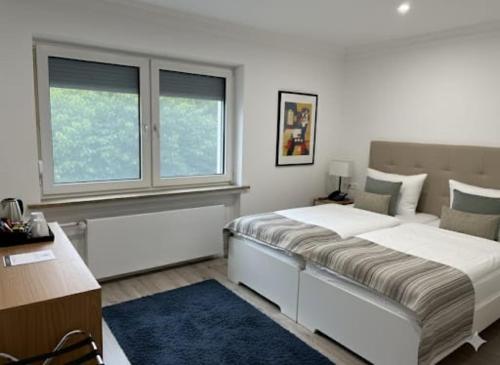 Ένα ή περισσότερα κρεβάτια σε δωμάτιο στο Hotel Aqua